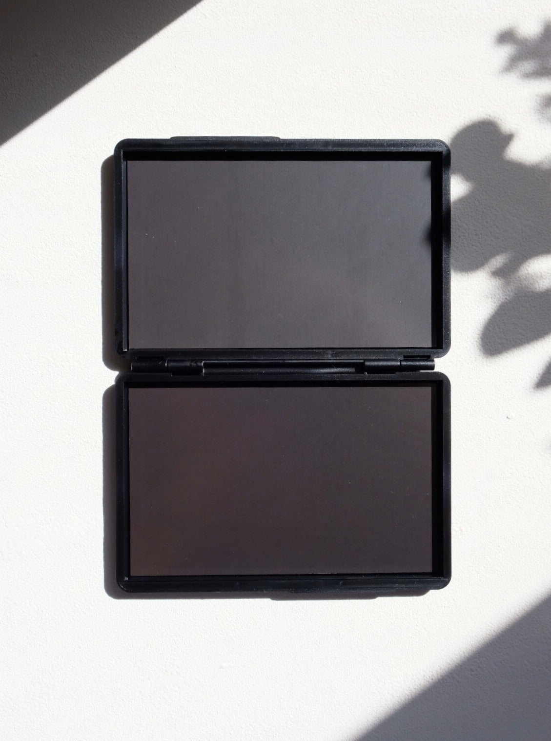 Clash Beauty Empty Double Sided Magnetic Eyeshadow Palette opened on white background with shadows