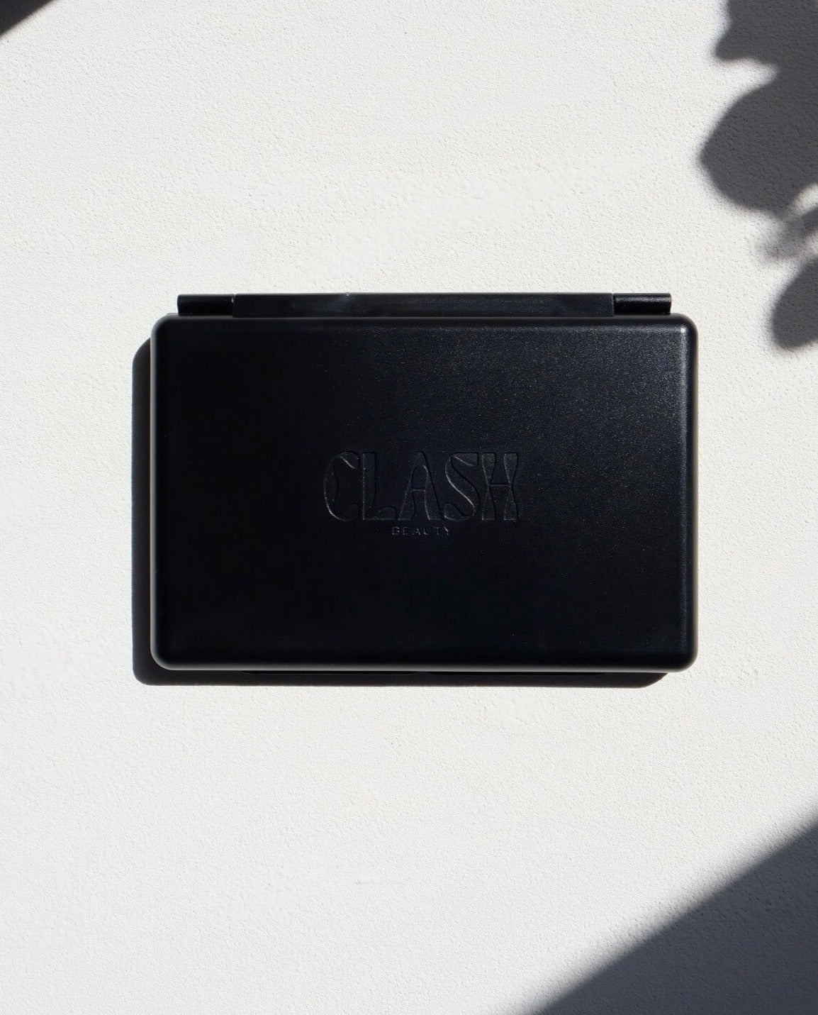 Clash Beauty Matte Black Double Sided Empty Eyeshadow Magnetic Palette closed on white background