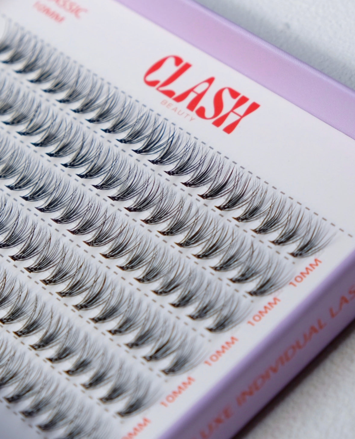 Close up image of Clash Beauty individual lashes. Classic style 20D density, recyclable eco-friendly packaging in large box