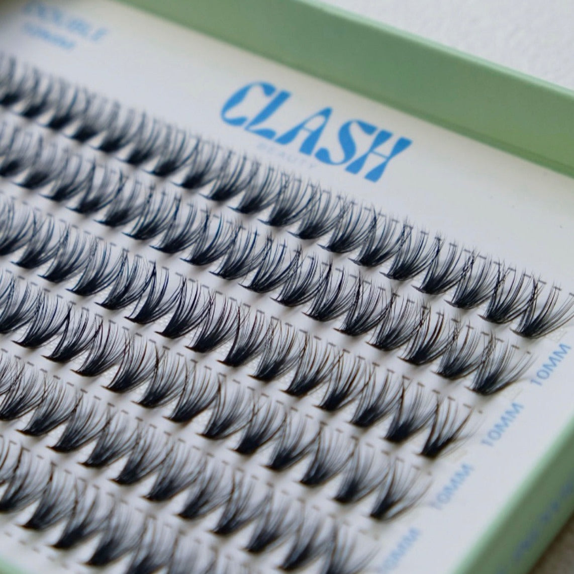 Close up image of Clash Beauty Luxe individual lashes. Double style 30D density, recyclable eco-friendly packaging in large box