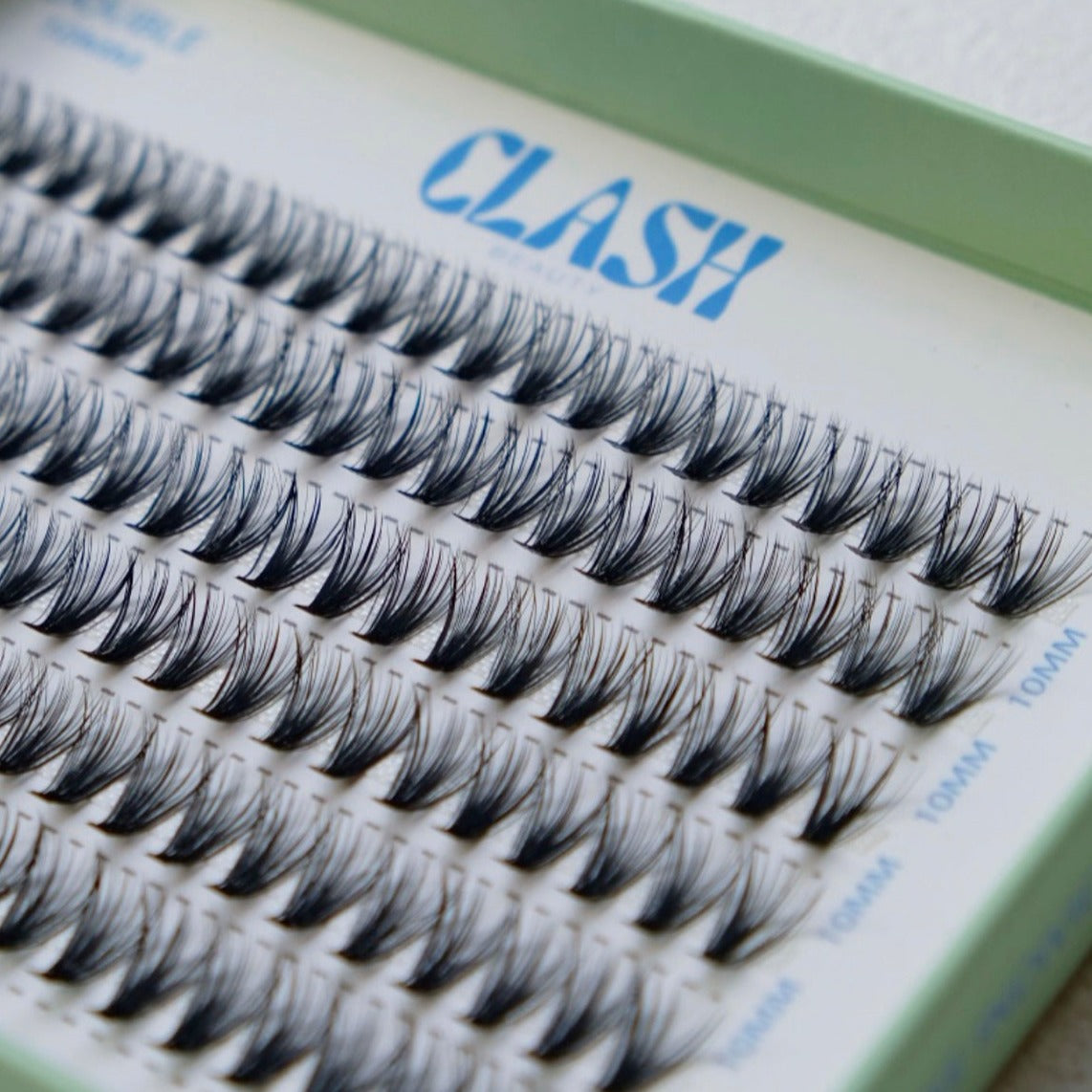 Close up image of Clash Beauty Luxe individual lashes. Double style 30D density, recyclable eco-friendly packaging in medium box